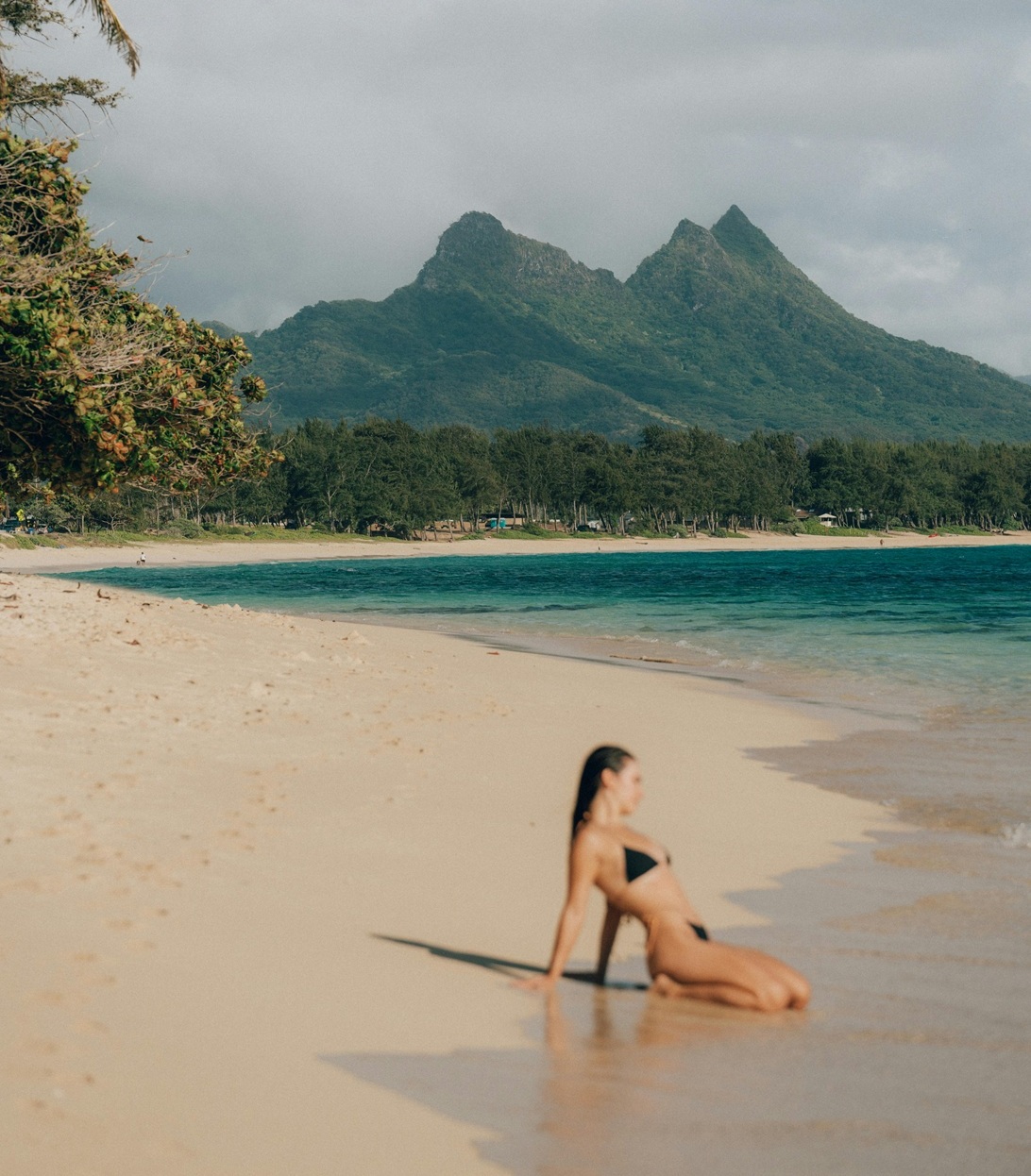 Lone figure creating emphasis within a balanced beach landscape